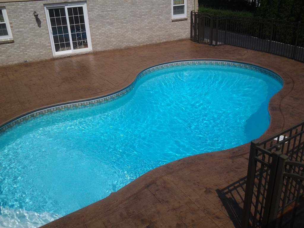 Swimming pool and stamped concrete project example 156